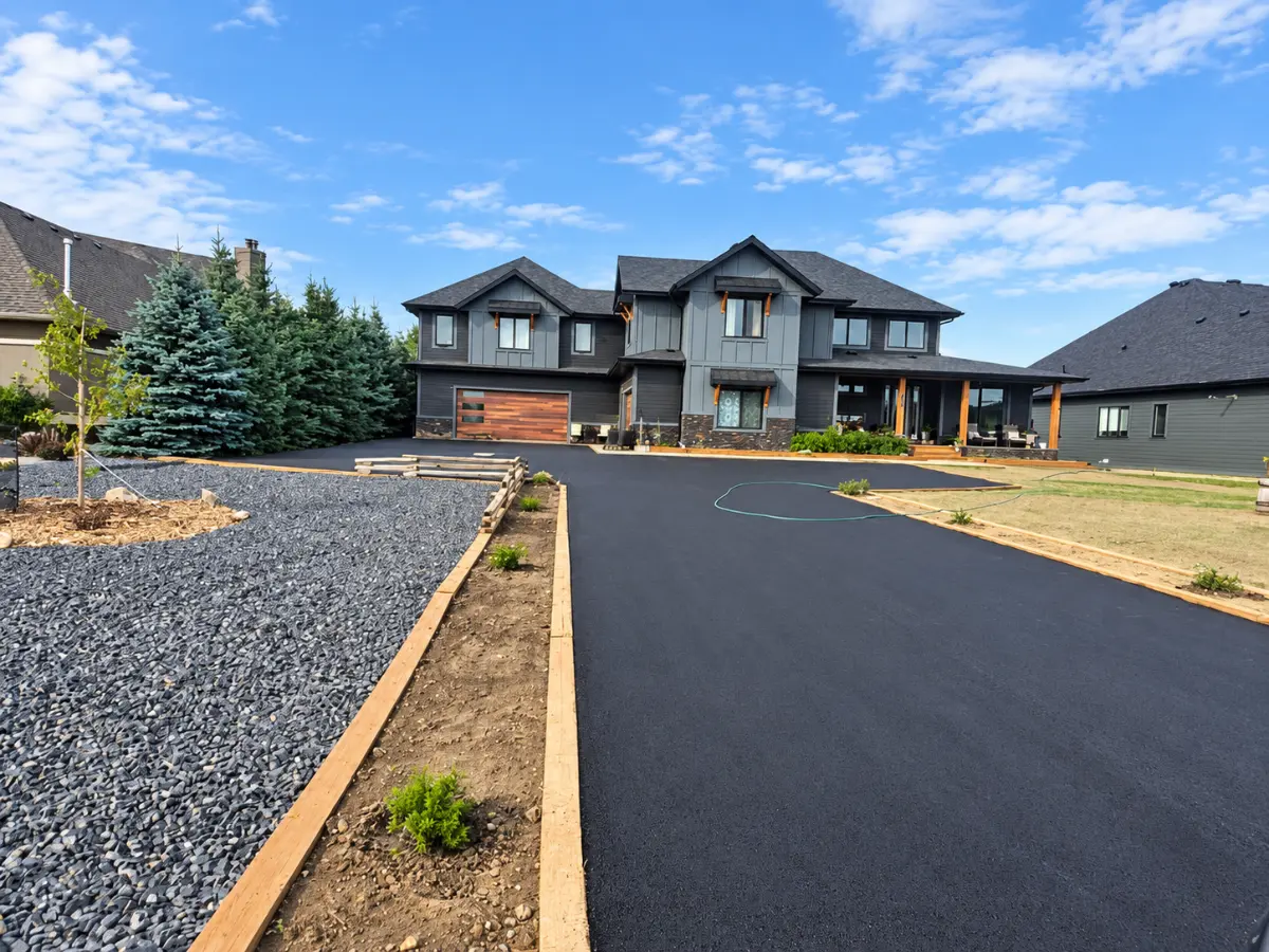 Freshly paved acreage estate driveway
