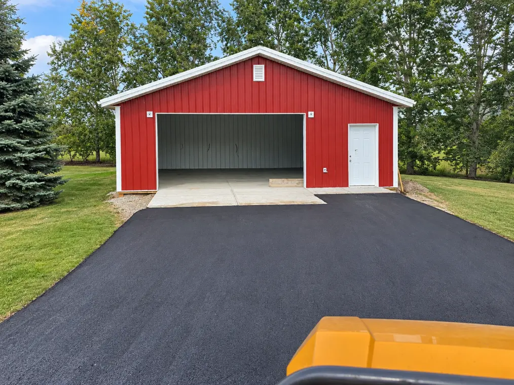 New Era Paving roller on fresh asphalt