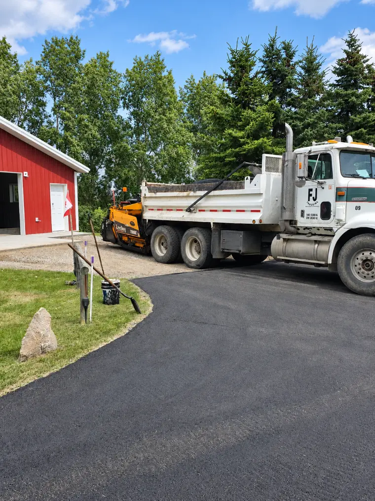 New Era Paving crew at sunset
